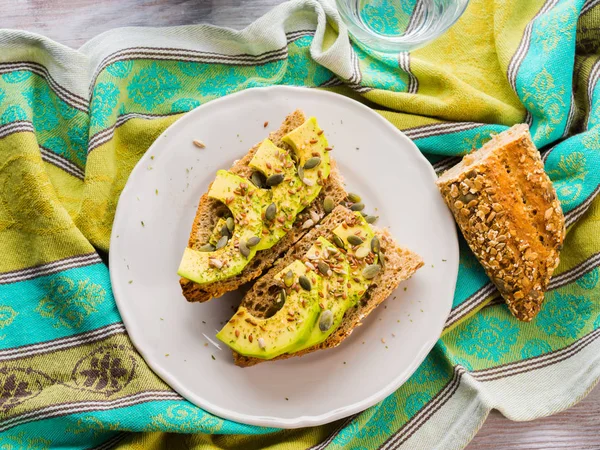 Avocado sandwich for healthy snack with seeds