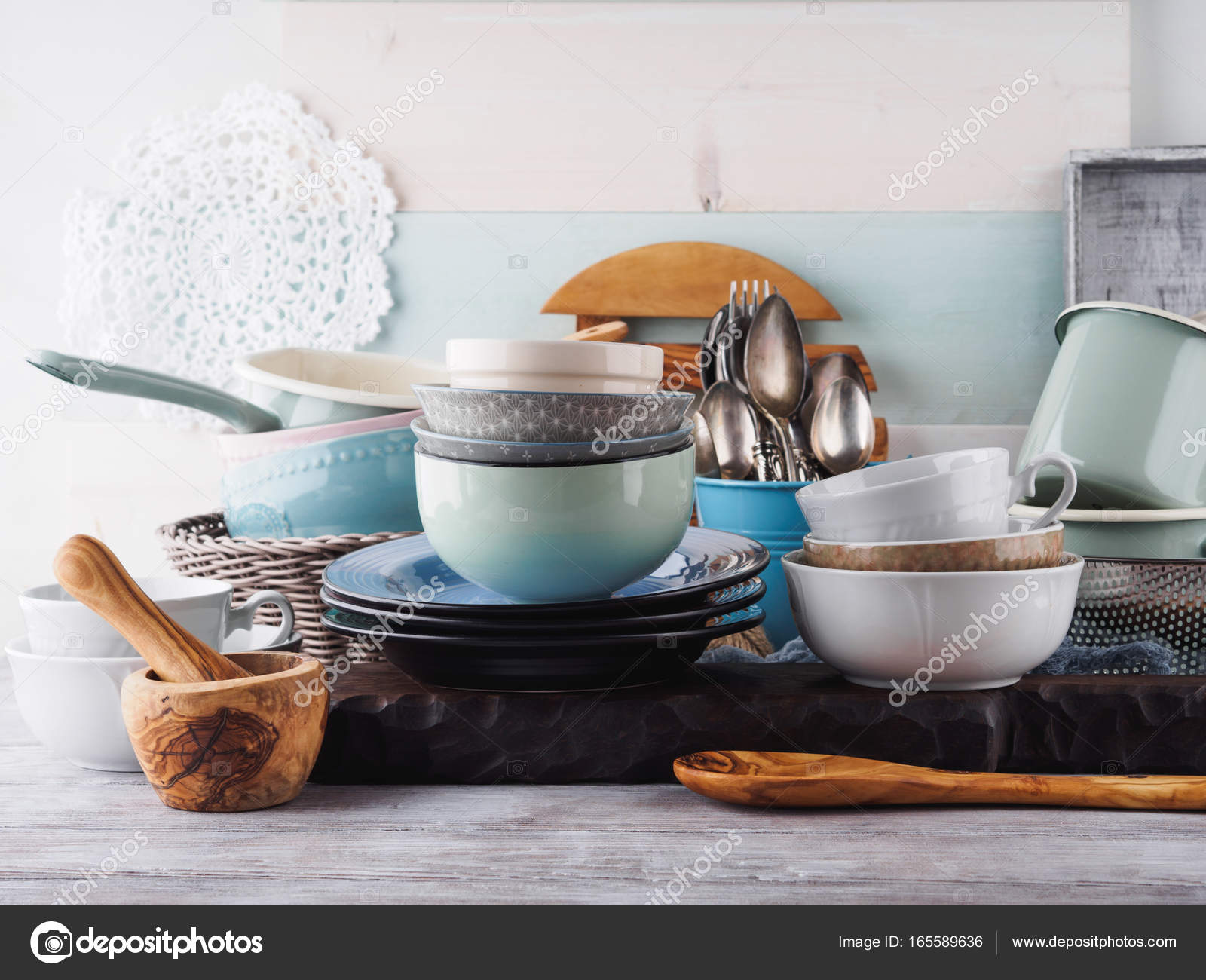 Ceramic and enamel crockery on wooden background — Stock Photo