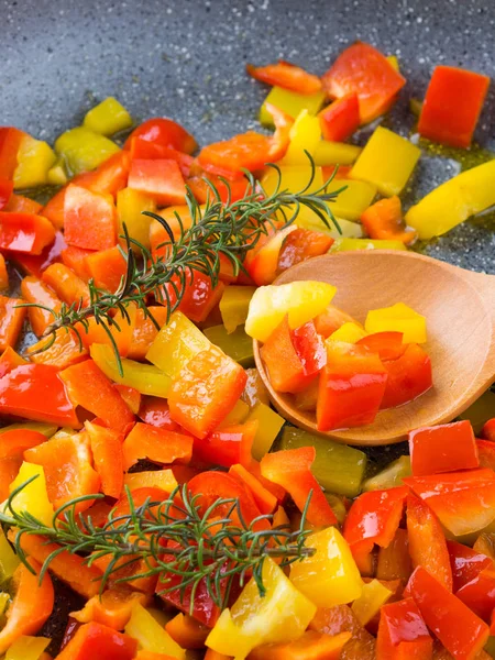 Cooking bell peppers with rosemary — Stock Photo, Image