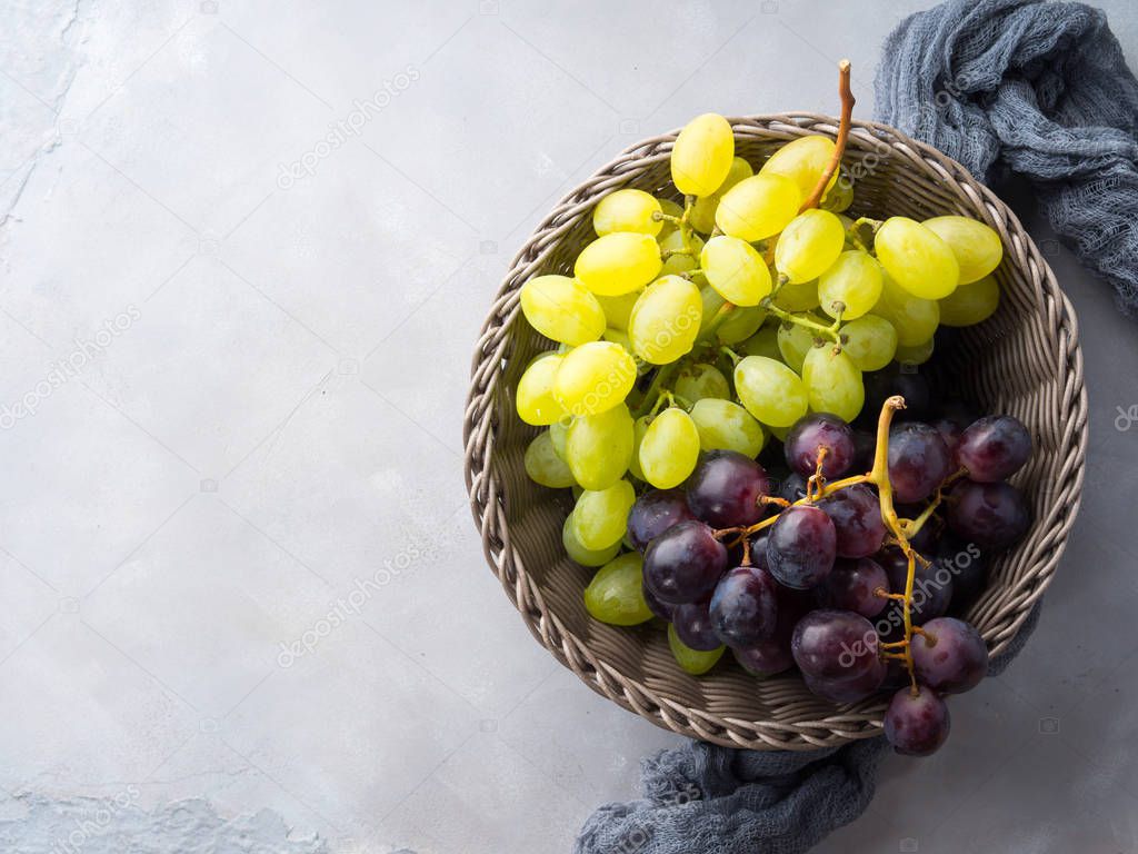 White and dark grapes in a basket