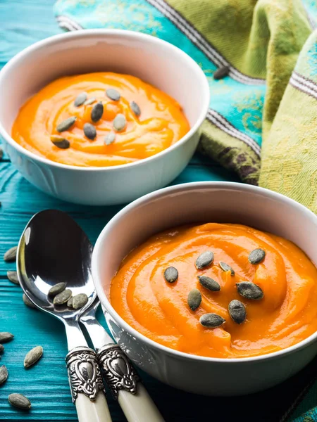 Creamy pumpkin soup in white bowls — Stock Photo, Image