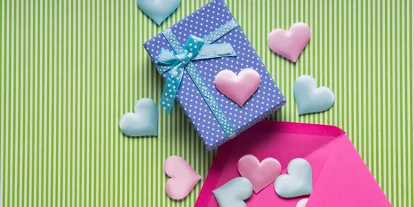 Blue gift box, hearts and envelope — Stock Photo, Image