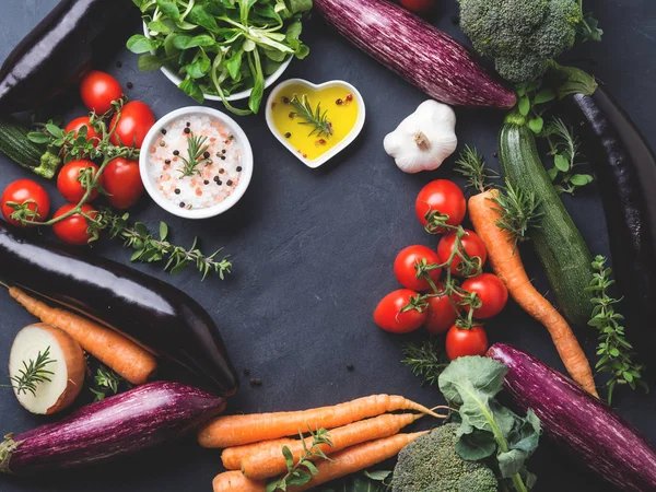 Mix of raw vegetables with salt, spices on dark