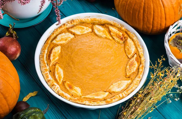 Autumn thanksgiving background with pumpkin pie