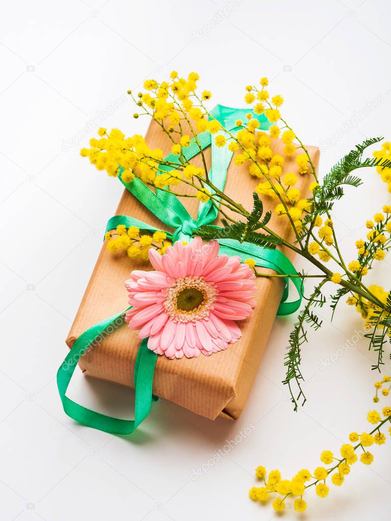 Womans day. Gift box with mimosa flowers
