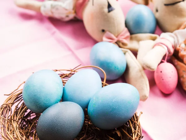 Pink easter holiday concept with bunny and eggs