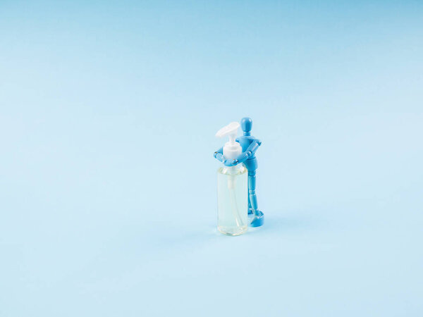 Puppet hugging sanitizer gel. Mysophobia, Covid-19