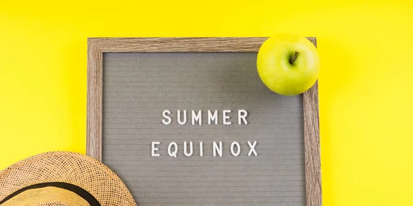 Summer equinox text on letter board on yellow