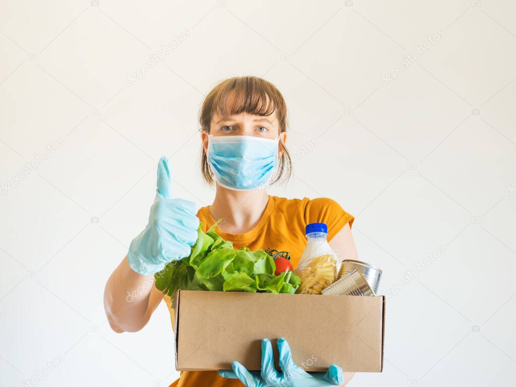 Woman in face mask with food delivery box