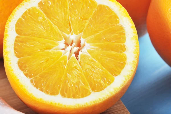 Fresh juicy orange, cut in half — Stock Photo, Image