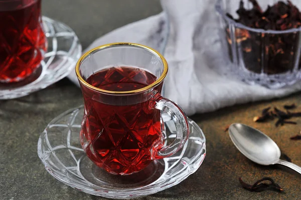 karkade tea -  red tea in Turkish cups on a grey background