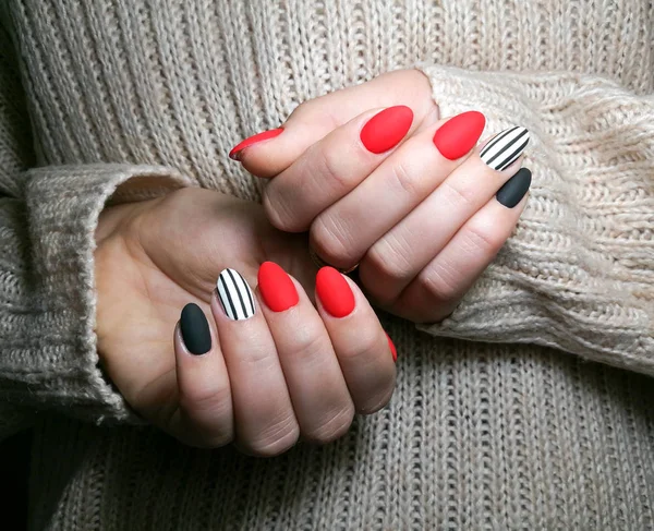 Close-up of young women with  multicolored nails gel manicure .Girl  with her hands behind — ストック写真