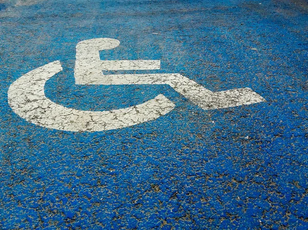 Street sign people with disabilities on blue background