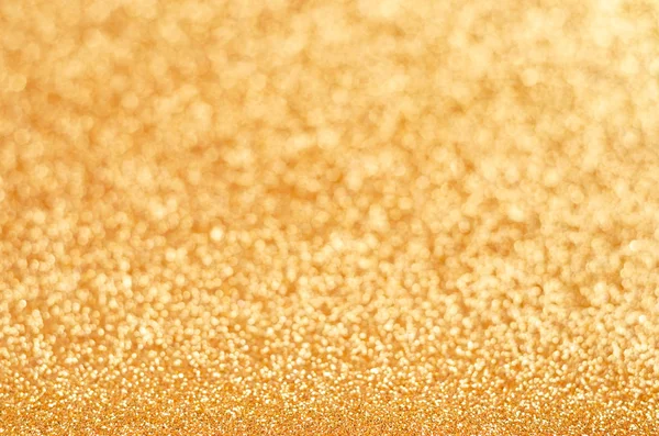 Brillo dorado borroso brillante brillo textura fondo. Fondo de decoración de Navidad  . — Foto de Stock