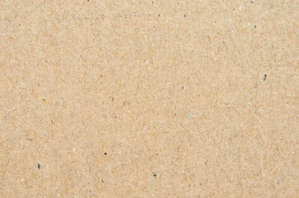 Kahverengi kağıt işçiliğinin arka planında, Top view 'de, düz yerde. Hediye kağıdı .