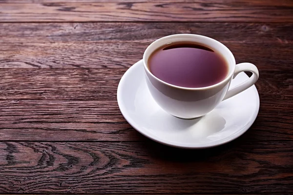 木製の背景トップ ビューにお茶のカップ — ストック写真