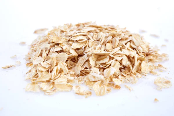 Oat flakes isolated on white. Closeup view — Stock Photo, Image