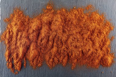 Doku arka plan. Kırmızı biber biber tozu. Üstten Görünüm