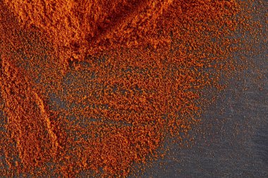 Doku arka plan. Kırmızı biber biber tozu. Üstten Görünüm