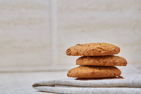 Stack of Chocolate chip cookies on wooden background. Stacked chocolate chip cookies shot with selective focus. — Stock Photo, Image