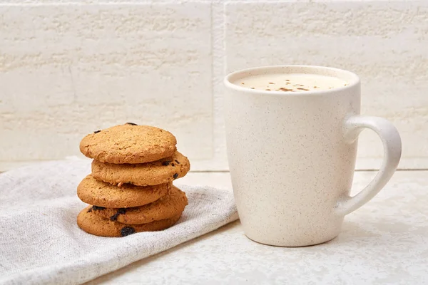 Close-up white cup of coffee with chocolate chip cookies on white background, top view — Stock Photo, Image