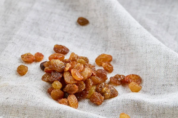 Top view close-up picture of dried apples on light cotton tablecloth, selective focus. — Stock Photo, Image