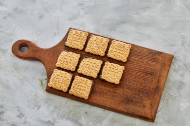 Üstten Görünüm yakın çekim resim lezzetli Kurabiye kesme tahtası, seçici odak üzerinde