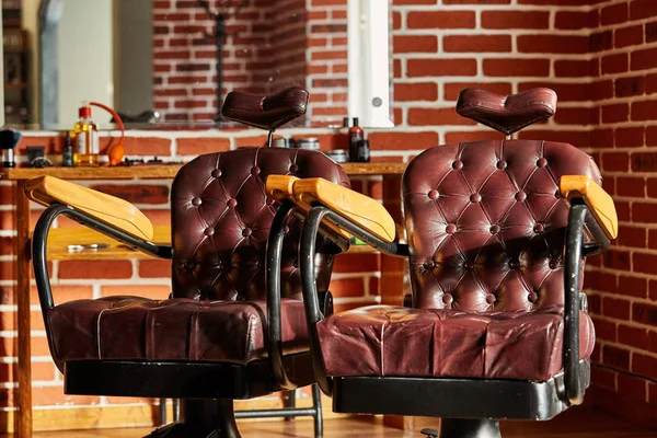 Retro leather chair barber shop in vintage style. Barbershop theme.
