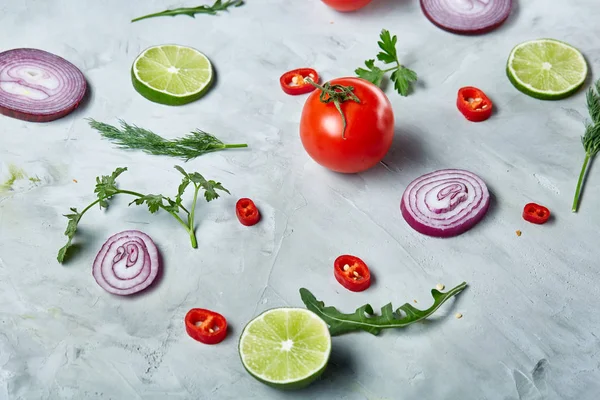 Seamless pattern with lemon, onion, tomatoes, lime, dill on white background, top view, close-up, selective focus