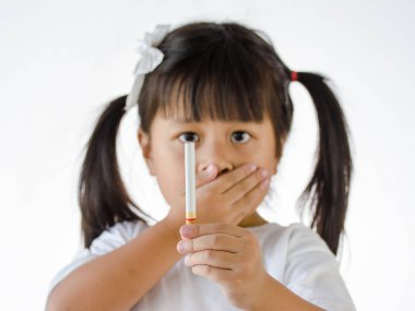 Cigarette in hand little Girl, cigarette focus