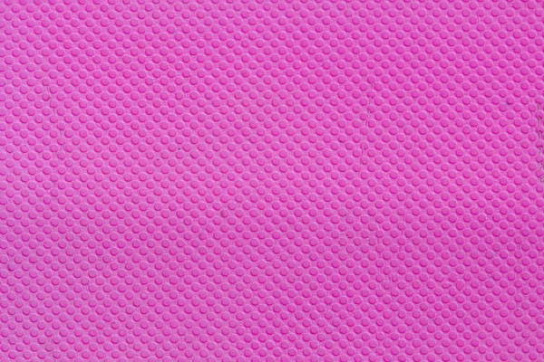 Rózsaszín műanyag felület mintás háttérrel — Stock Fotó