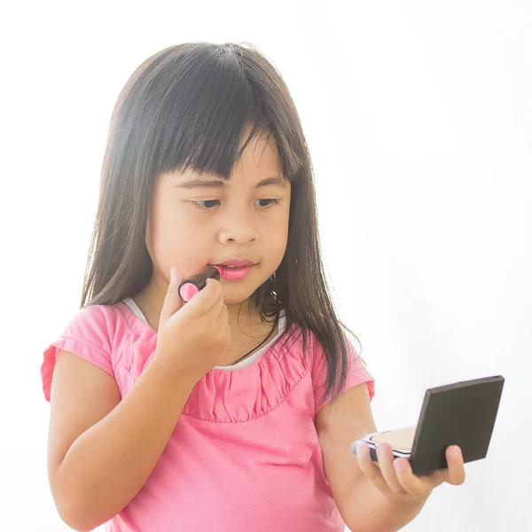 Adorable little girl playing with mommy's makeup — Stock Photo, Image