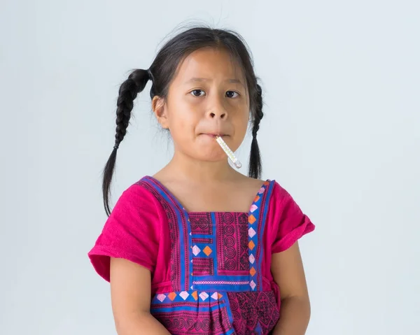 Little cute girl kid sitting with mercury thermometer in her mou — Stock Photo, Image