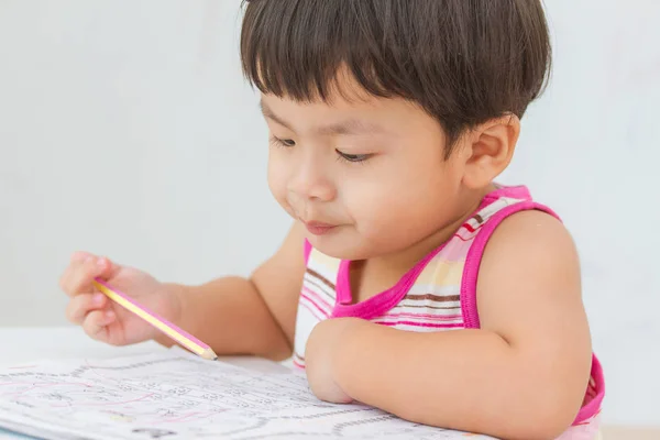 Little boy writing white paper — Stock Photo, Image