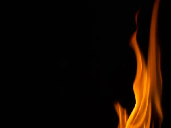 Fire burning in black background — Stock Photo, Image