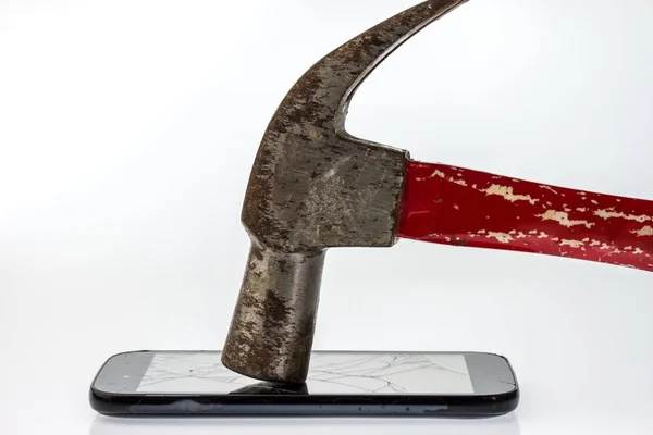 Hammer, mobile smartphone with broken screen and dust on screen. — Stock Photo, Image