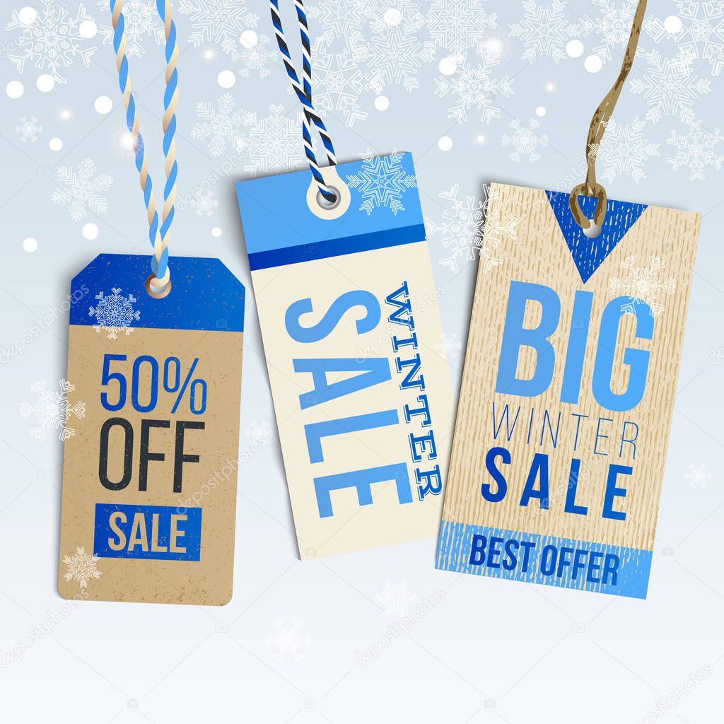 Winter sale realistic tags on winter background