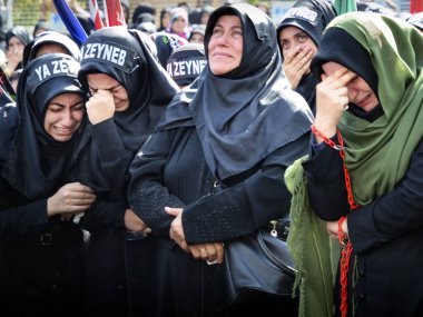 Shia Muslim women are crying mourn during Ashura ceremony clipart
