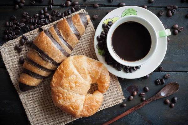 Coffee and freshly baked butter croissant and chocolates butter — Stock Photo, Image