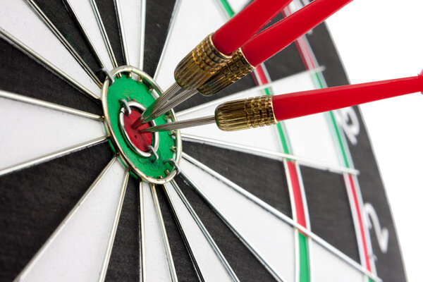 Red arrow is center of target dartboard on white background.,Con
