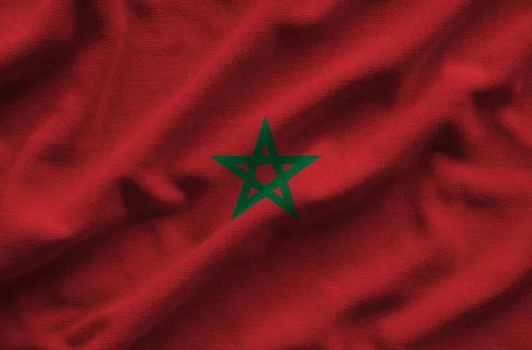Флаг Марокко. Флаг имеет детализированную реалистичную текстуру ткани . Стоковая Картинка