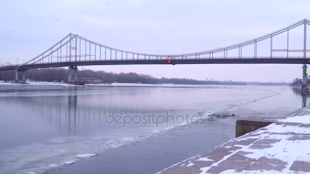 Bridge over the frozen river — Stock Video