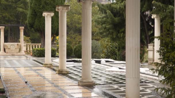 Marble columns in the rain — Stock Video