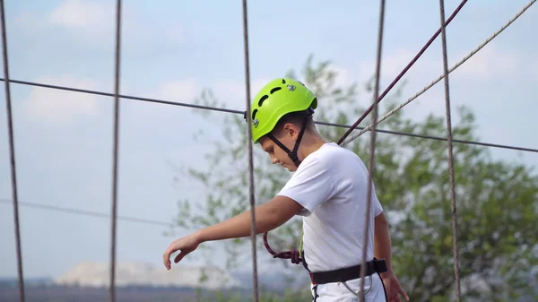 Teenager in helmet on the cable car — Stock Photo, Image
