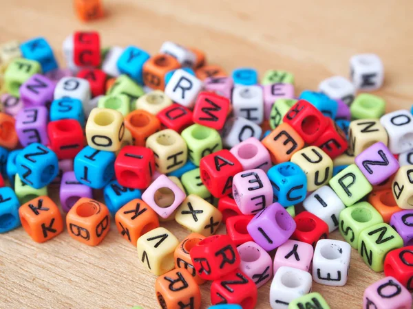 Alphabet in print on small plastic cubes — Stock Photo, Image