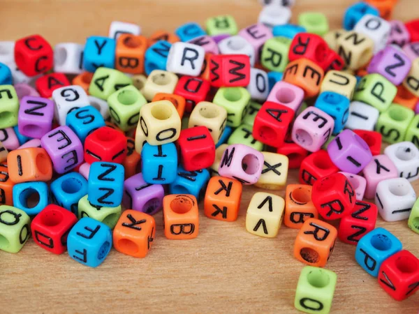 Alphabet in print on small plastic cubes — Stock Photo, Image