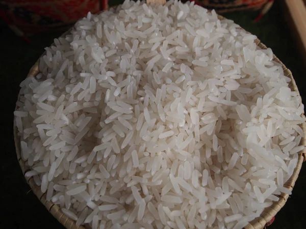 Rice in colorful bamboo bowl on rack — Stock Photo, Image