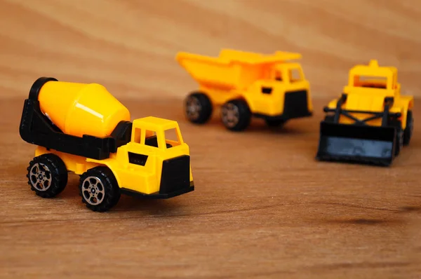Grupo de pequeno brinquedo de máquina de construção pesada, caminhão, escavadeira e misturador de concreto . — Fotografia de Stock
