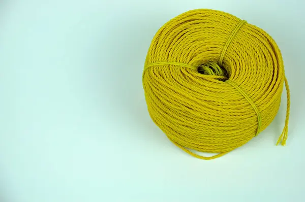 A roll of yellow nylon rope — Stock Photo, Image