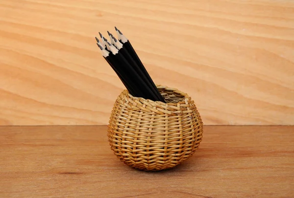 Pencils tied with a rope of straw and place in a container — Stock Photo, Image